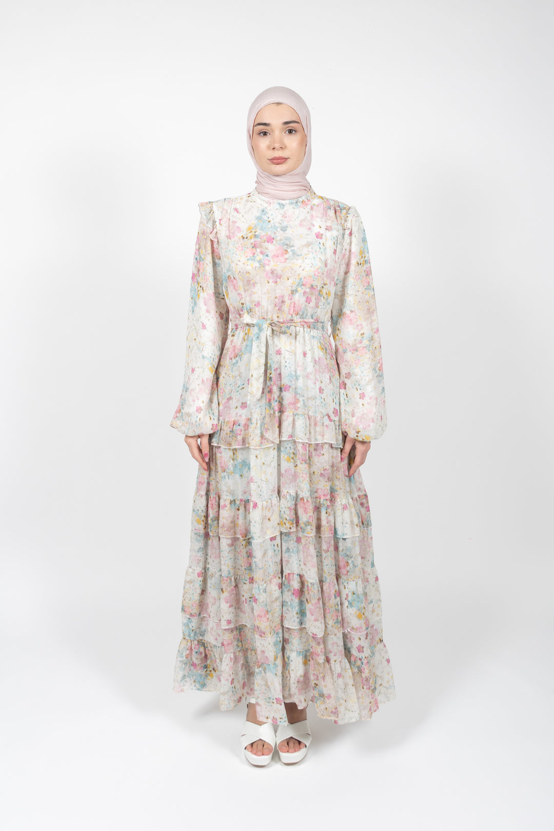 Woman wearing a floral dress on a white background