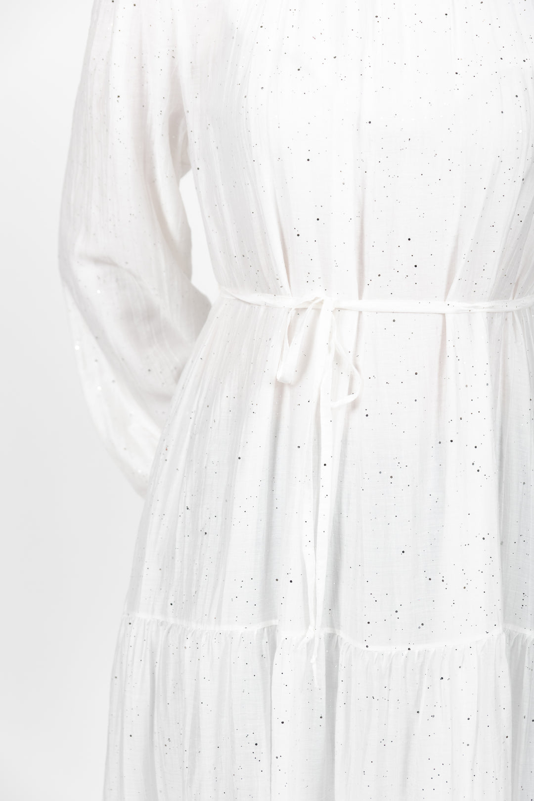 White dress with subtle pattern on a white background