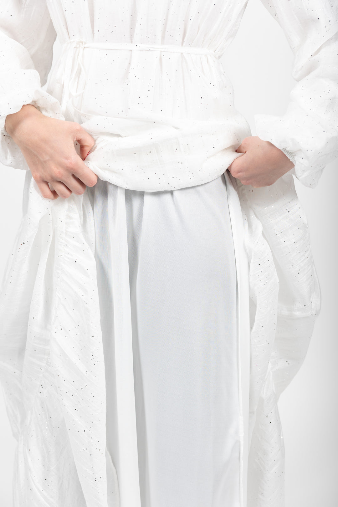White dress with a subtle pattern on a white background