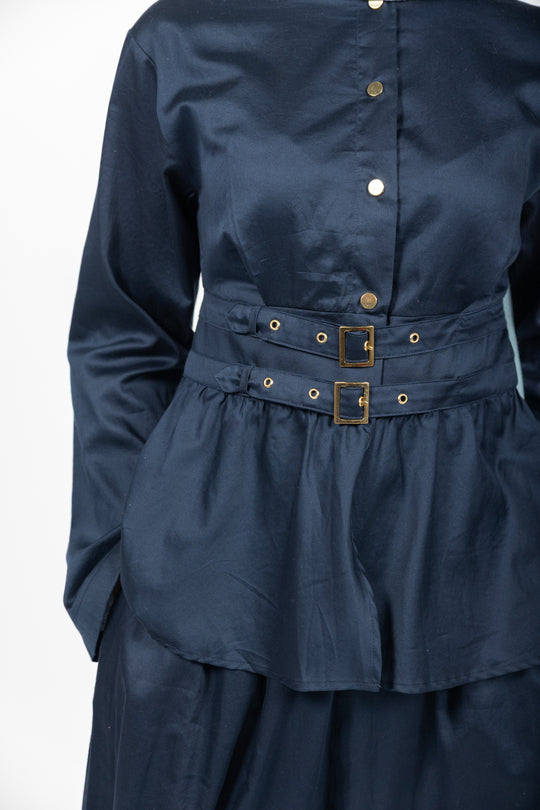 Navy blue dress with a belt on a white background