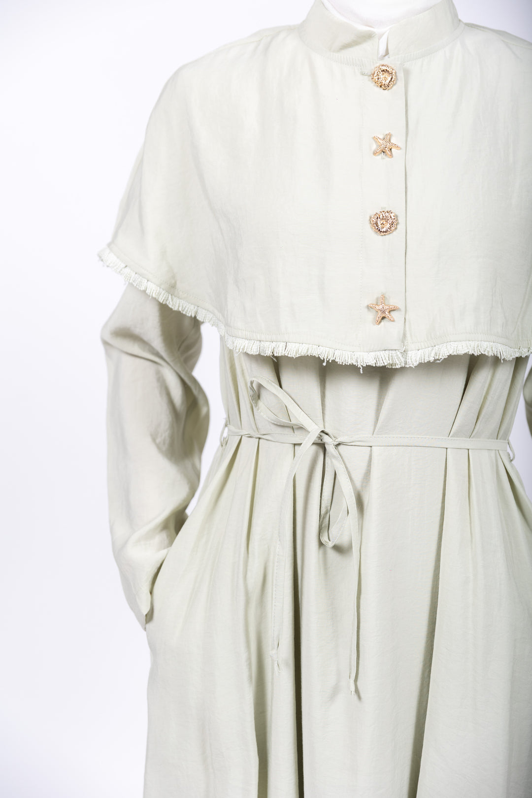 Light green dress with a matching jacket on a white background